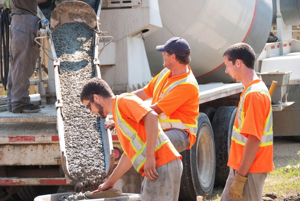 Concrete Contractors Pouring Concrete from Truck - Fort Myers